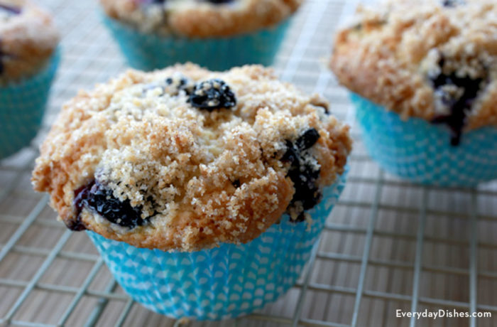A batch of freshly baked blueberry crumble muffins