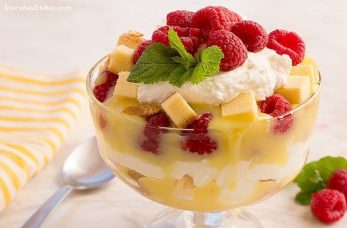 A bowl with a tasty, homemade raspberry lemon curd trifle dessert.