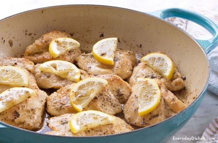 A skillet of savory lemon chicken, ready to serve for dinner.