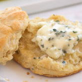 A flaky biscuit topped with easy, homemade blue cheese butter.