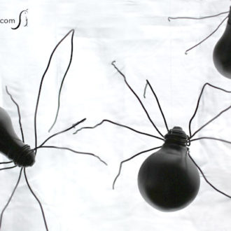 Some cute, DIY spiders made of light bulbs — a fun Halloween craft.