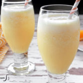 Two glasses of a refreshing, homemade Orange Julius.