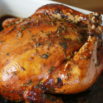 A roasted chicken that's fresh out of the oven.