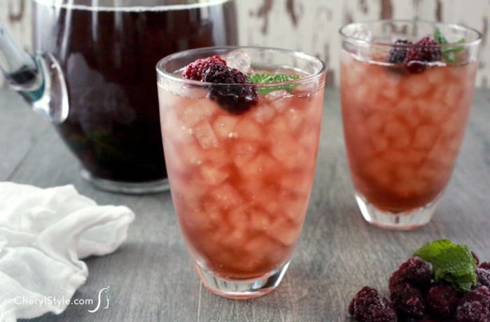 Two glasses of a refreshing blackberry mint iced tea