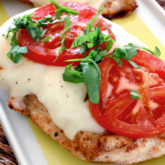 A delicious caprese grilled chicken, ready for dinner.