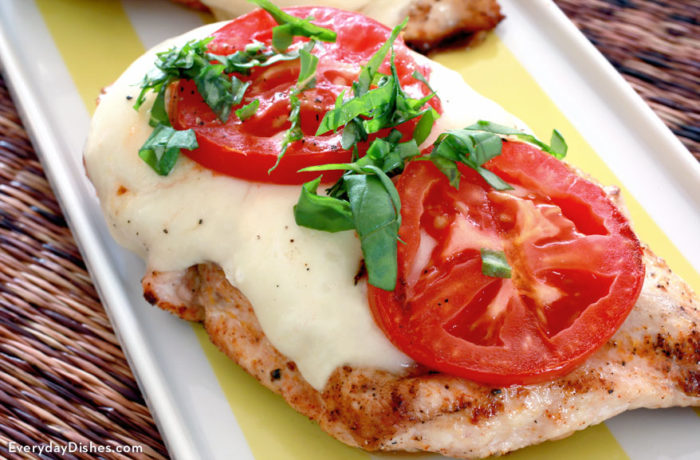 A delicious caprese grilled chicken, ready for dinner.
