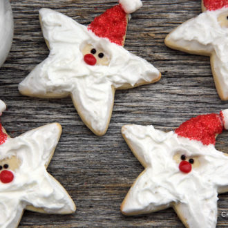 A batch of star-shaped decorated Santa cookies