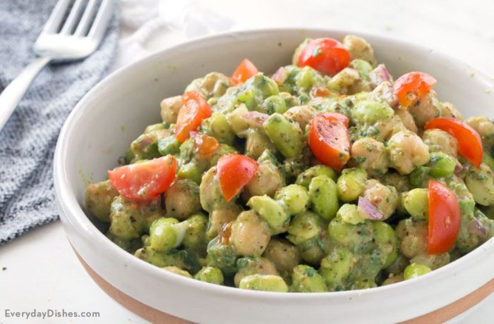 A bowl full of edamame chickpea salad with avocado dressing.