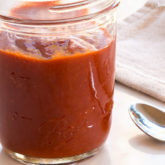 A jar of homemade Sriracha sauce.
