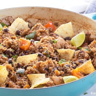 A skillet of one pan Mexican chicken quinoa that's ready to serve for dinner.