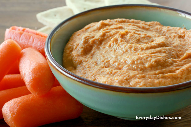A bowl of homemade roasted red pepper hummus.