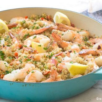 A pan of garlic butter, shrimp, and quinoa, ready to serve for dinner.
