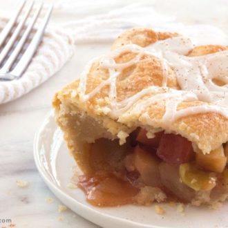 A slice of apple slab pie, on a plate and ready to enjoy.