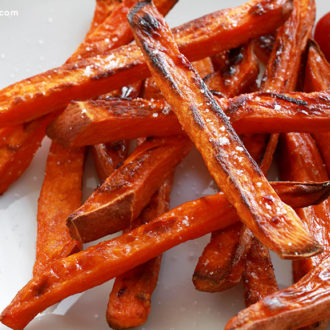 A plate of homemade baked sweet potato fries.