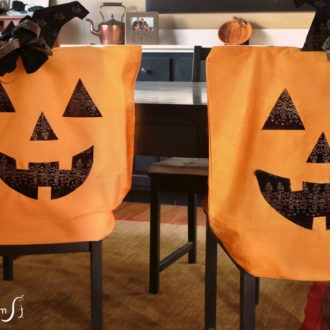 A pair of DIY Halloween pillowcase chair covers