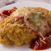 A plate of quinoa chicken parmesan, ready to have for dinner.