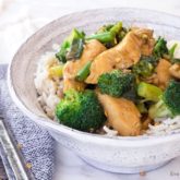 A bowl with chicken broccoli stir fry served over rice. A great dinner.