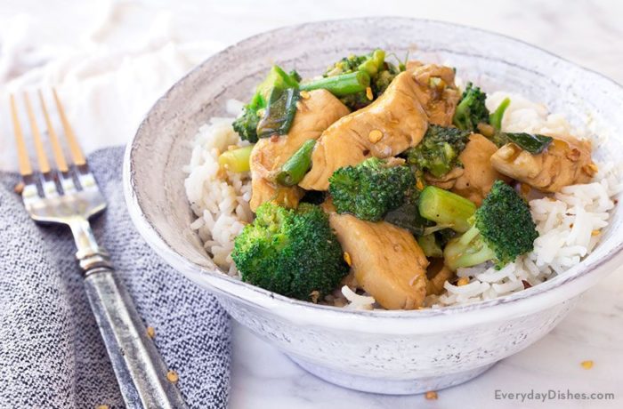 A bowl with chicken broccoli stir fry served over rice. A great dinner.