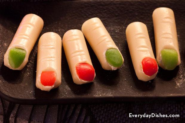 Cheese sticks decorated to look like fingers, perfect for Halloween.