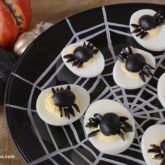 Creepy crawly spider deviled eggs — a Halloween twist on a classic appetizer.