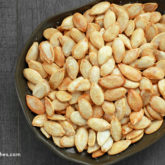 A bowl of homemade roasted pumpkin seeds — a healthy and tasty snack.