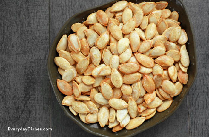 A bowl of homemade roasted pumpkin seeds — a healthy and tasty snack.