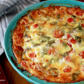 A freshly made crust-less tomato basil quiche