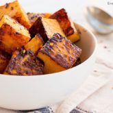 A bowl of delicious caramelized butternut squash.