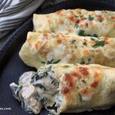 Savory chicken crepes with spinach and mushrooms.