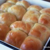 A batch of homemade yeast rolls, fresh out of the oven.