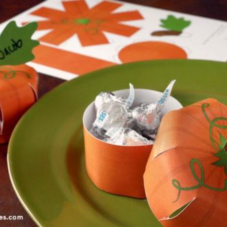 Printable pumpkin place cards that double as a treat box make a fun addition to a fall table.