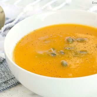 A bowl of butternut squash soup that was made in a slow cooker.