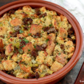 A pan full of sourdough stuffing with sausage
