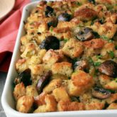Vegetarian stuffing with sourdough and mushrooms that's in a pan and ready to enjoy for Thanksgiving.