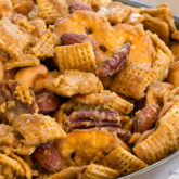 A bowl full of an addicting toffee Chex mix; the perfect snack.
