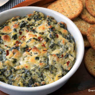 A bowl of homemade hot spinach and artichoke dip