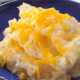 A plate of cheesy mashed potatoes, a delicious and healthy side.