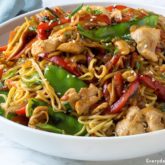 A bowl of chicken stir-fry with noodles