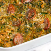 A dish with a homemade garden vegetable and brown rice casserole.