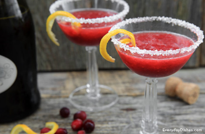 Two glasses of a refreshing raspberry champagne punch cocktail.