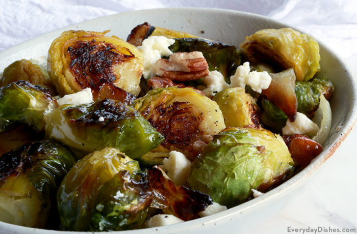 A bowl of roasted Brussels sprouts with feta, a great side dish.