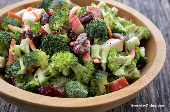 A bowl full of broccoli apple salad
