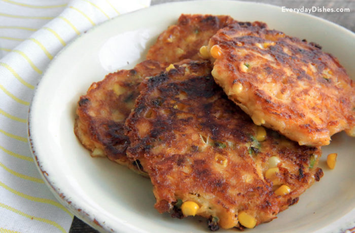 A plate of delicious cheesy corn cakes, great for an appetizer or side dish.