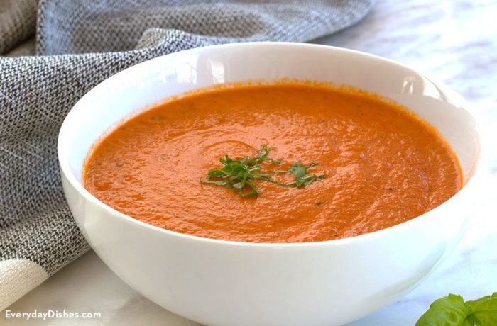 A bowl of creamy roasted tomato basil soup, ready to enjoy for lunch or a side dish.