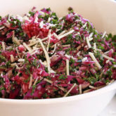 A bowl of a delicious and healthy kale and cabbage confetti salad.