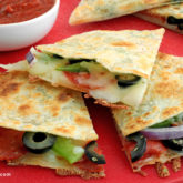 A batch of homemade, easy pizzadillas, cut up into slices.