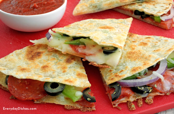 A batch of homemade, easy pizzadillas, cut up into slices.