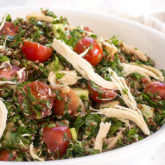 A bowl full of quinoa tabbouleh salad.