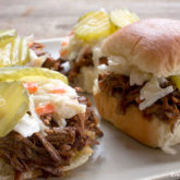 A plate of delicious beef sliders, with beef made in a slow cooker.