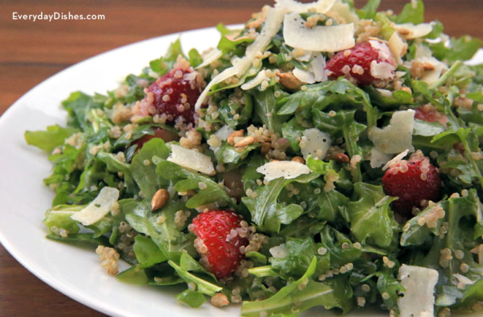 A plate of an arugula quinoa salad, ready to enjoy for lunch.